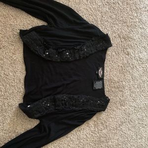 Goes over a shirt or tank top